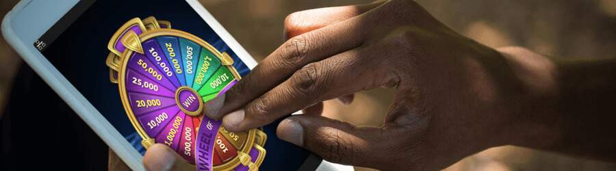 man playing wheel of fortune at USA mobile casinos